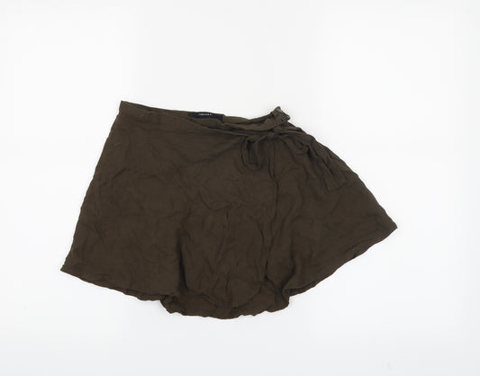 Front view of Forever 21 women’s green mini skirt, size XS