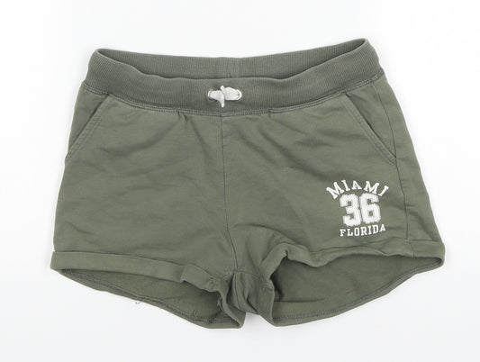 Front view of H&M girls’ green hot pants shorts, size 10-11, years