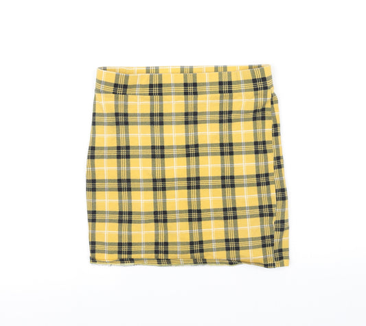 Front view of pre worn girls’ yellow cut-off shorts, size 12-13, years