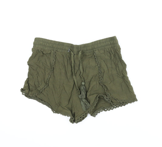 Front view of Primark women’s green paperbag shorts, size UK 8