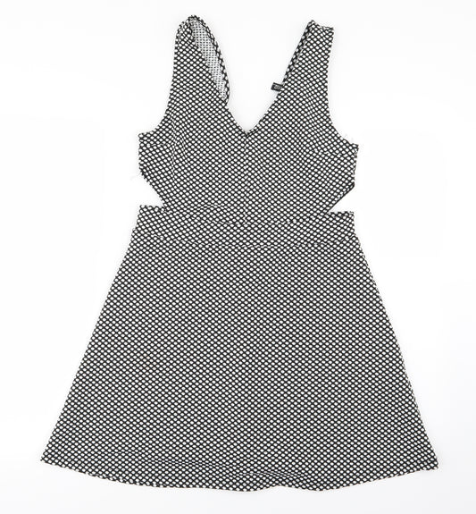Front view of Divided by H&M women’s white polka dot mini, size UK 10