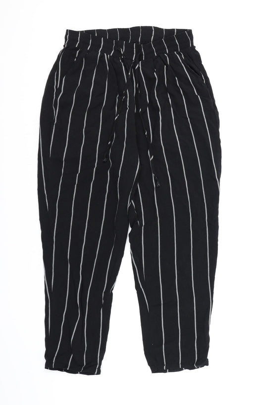Front view of PRETTYLITTLETHING women’s black striped harem trousers, size UK 10, 21-inch leg