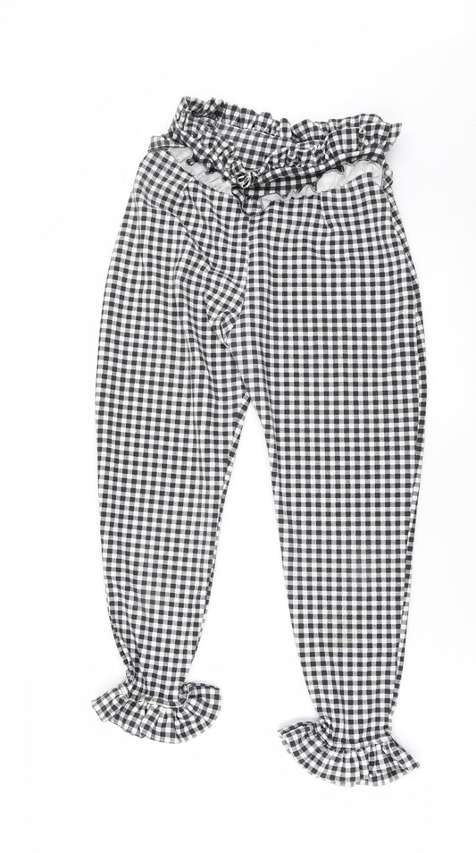 Front view of PRETTYLITTLETHING women’s black check chino trousers, size UK 8, 24-inch leg - frilled hem