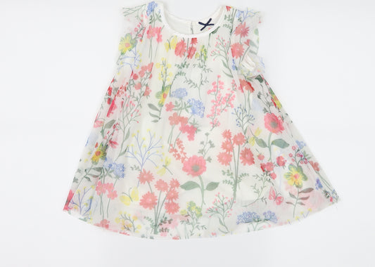 Front view of St Bernard girls’ white floral mesh a-line, size 9-12, months