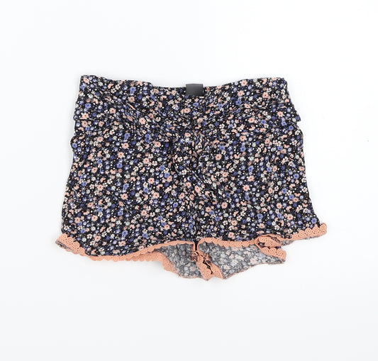 Front view of Primark girls’ black floral bermuda shorts, size 5-6, years