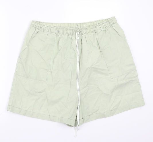 Front view of Preworn women’s green bermuda shorts, size UK 20