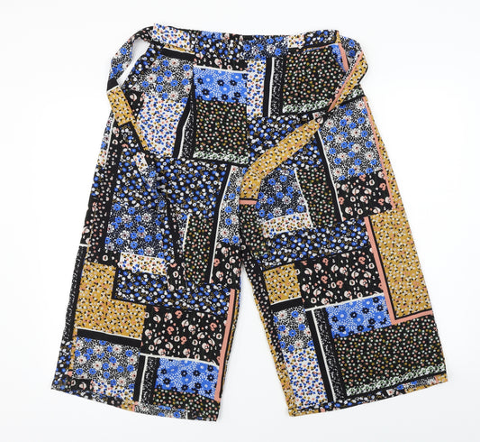 Front view of Primark women’s black floral trousers, size UK 10, 20-inch leg