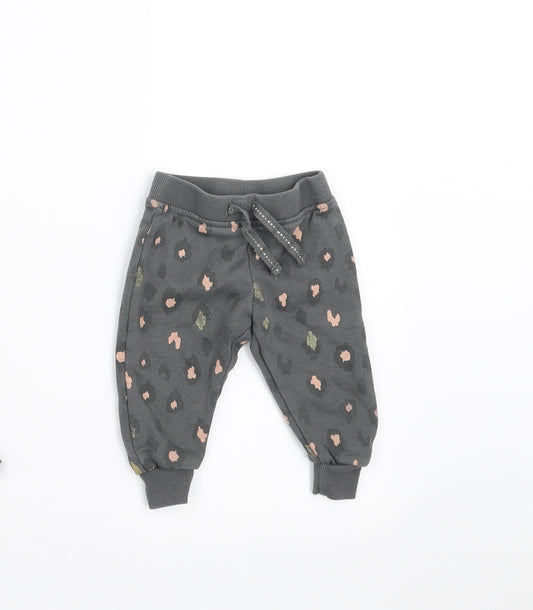 Front view of Primark girls’ grey animal print jogger trousers, size 3-6, months