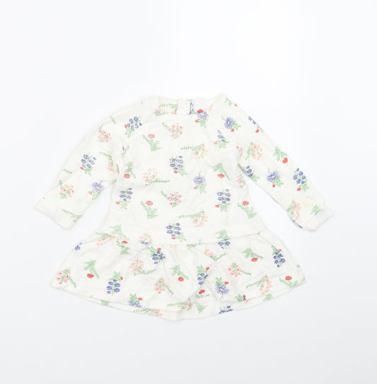 Front view of Dunnes Stores girls’ white floral fit & flare, size 6-9, months