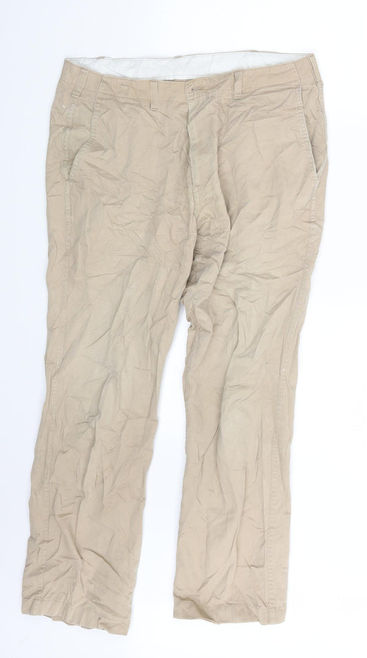 Front view of Preworn men’s beige chino trousers, size 32, 20-inch leg