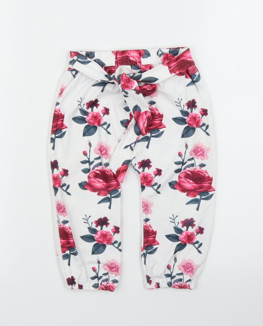 Front view of Preworn girls’ white floral capri leggings, size 12, months