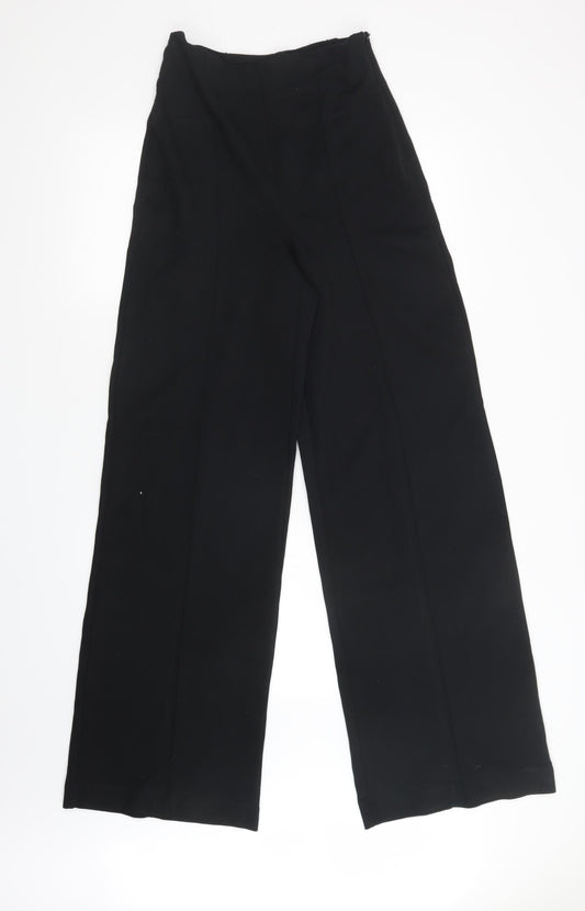 Front view of Preworn women’s black trousers, size UK 26, in, 32-inch leg