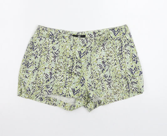 Front view of H&M women’s green animal print bermuda shorts, size UK 6