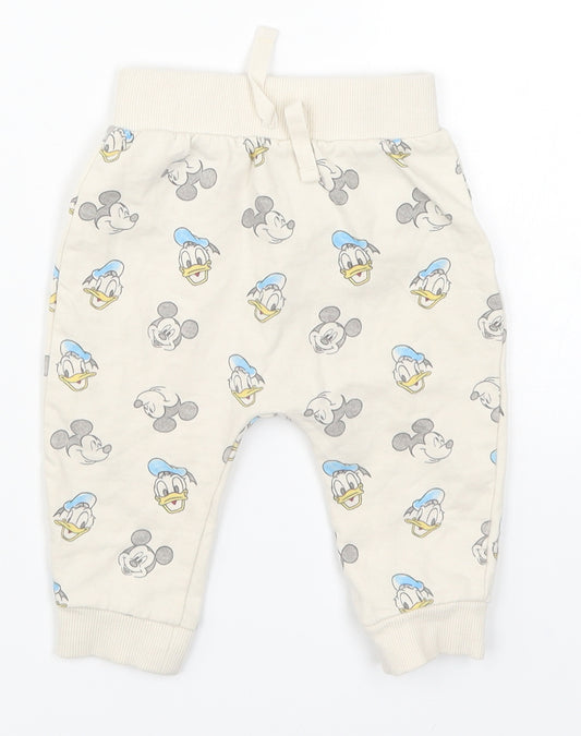 Front view of George Baby Beige sweatpants, size 3-6, Months - Mickey Mouse Donald Duck
