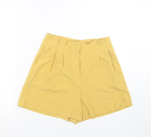 Front view of Primark women’s yellow hot pants shorts, size UK 10