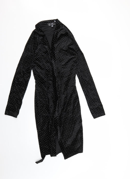 Front view of Missguided women’s black polka dot wrap dress, size UK 10