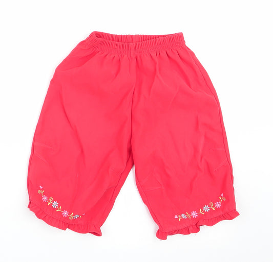 Front view of Ladybird girls’ red floral track pants trousers, size 6-9, months - floral trim