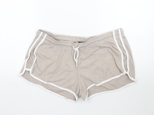Front view of Primark women’s beige sweat shorts, size L