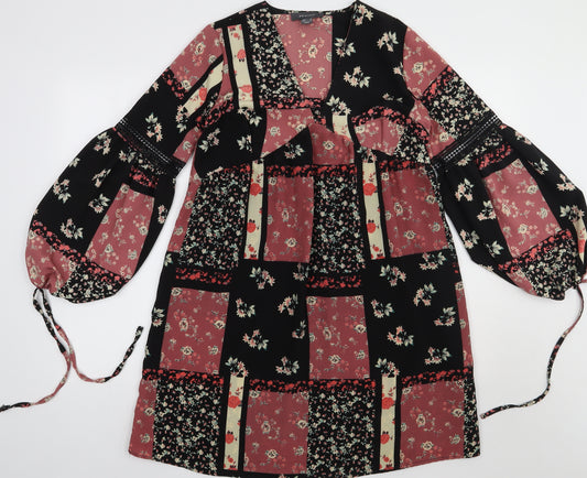 Front view of Primark women’s pink floral polyester a-line, size UK 10, v-neck pullover