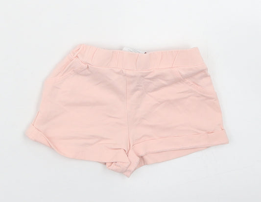 Front view of TJX girls’ pink cotton cropped trousers, size 9-12, months