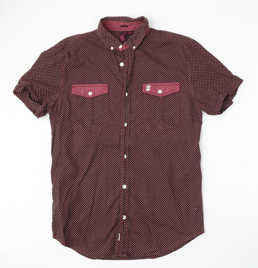 Front view of Be the revolution men’s red polka dot polyester polo, size L, collared button
