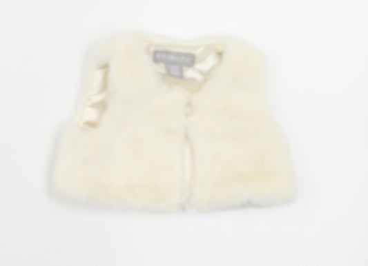 Front view of Primark girls’ white polyester cape jumper, size 0-3, months button