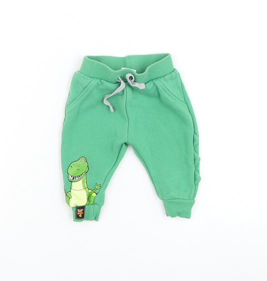 Front view of Primark boys’ green cotton jogger trousers, size 3-6, months drawstring - toy story